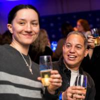 Grads take a selfie with their glasses